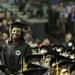 Eastern Michigan graduate and womens basketball star, Tavelyn James, smiles proudly as  EMU president Susan Martin speaks about her accomplishments to the crowd during commencement at the Convocation Center in Ypsilanti, on Sunday, April 29, 2012. For annarbor.com By: Joe Sharp